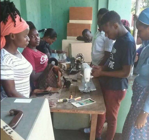 Single mothers learning tailoring skills